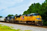 A WB Grain Train Patiently Awaits the Clearing of a Wreck Ahead